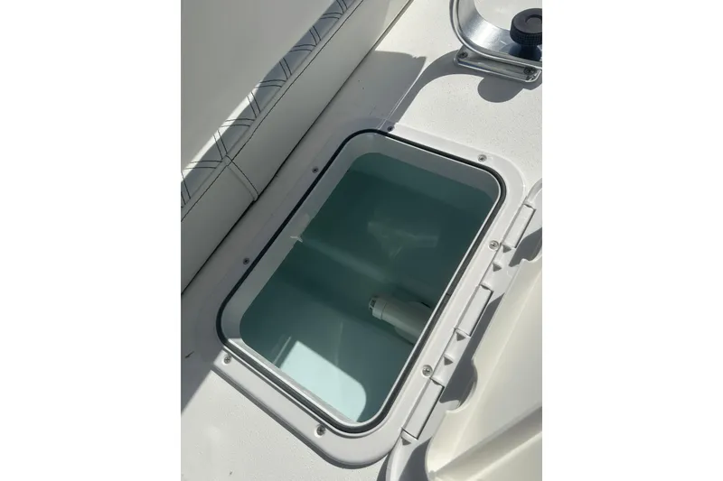 Slide: The Image of Open storage compartment on 2026 Delta Boatworks Delta D18 boat. - 16