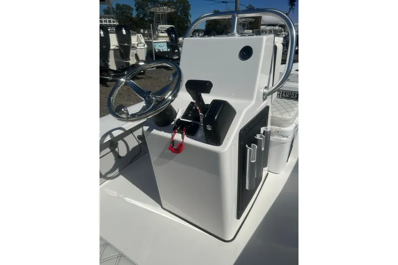 Slide: The Image of 2026 Delta Boatworks Delta D18 console with steering wheel and controls. - 18