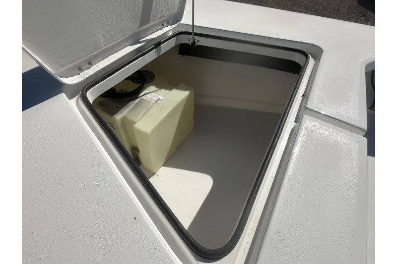 Slide: The Image of Open storage compartment on 2026 Delta Boatworks Delta D18, featuring a fuel tank. - 21