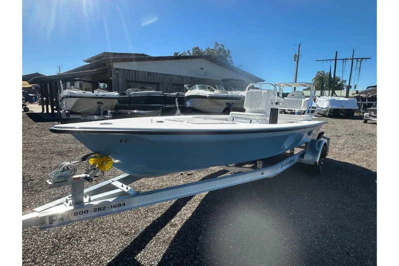 Slide: The Image of 2026 Delta Boatworks Delta D18 on trailer, displayed outdoors at a boat dealership. - 7