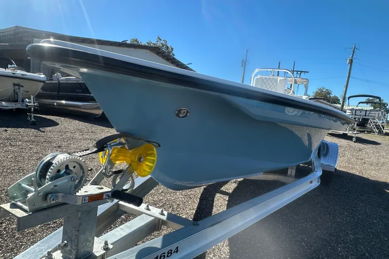 Slide: The Image of 2026 Delta Boatworks Delta D18 on trailer under clear blue sky. - 8