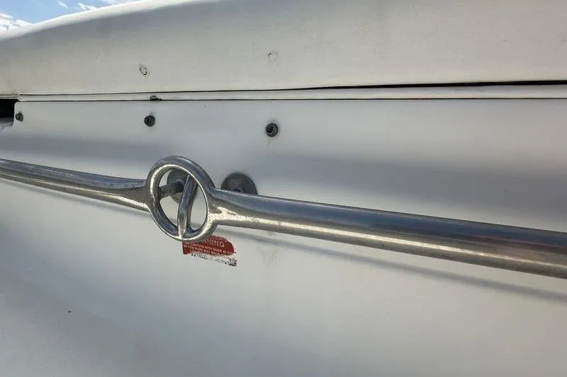 Slide: The Image of 1994 Sea Ray 220 Overnighter Signature boat railing detail with metal loop design. - 10