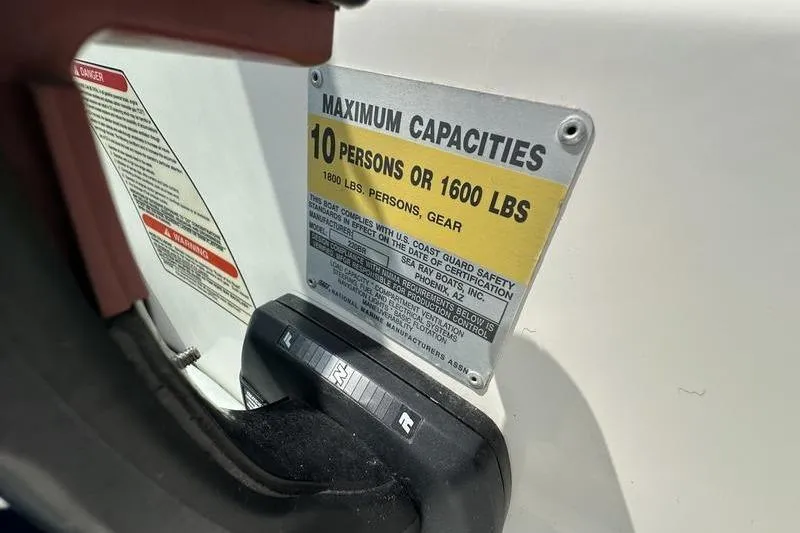 Slide: The Image of 1994 Sea Ray 220 Overnighter Signature capacity plate, 10 persons or 1600 lbs limit. - 16