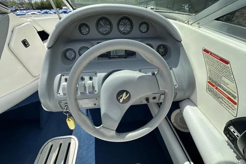 Slide: The Image of Steering wheel and dashboard of 1994 Sea Ray 220 Overnighter Signature boat. - 18