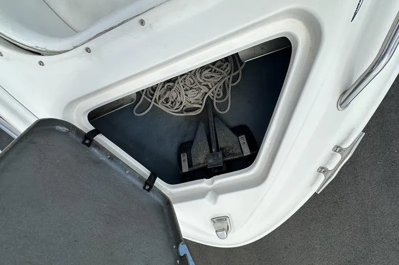 Slide: The Image of Anchor compartment of 1994 Sea Ray 220 Overnighter Signature with rope storage. - 30