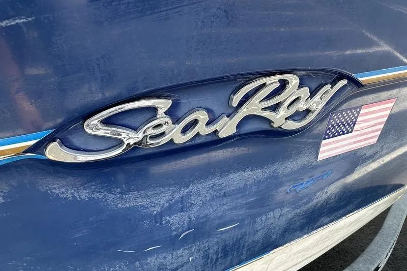 Slide: The Image of 1994 Sea Ray 220 Overnighter Signature boat with American flag decal. - 7