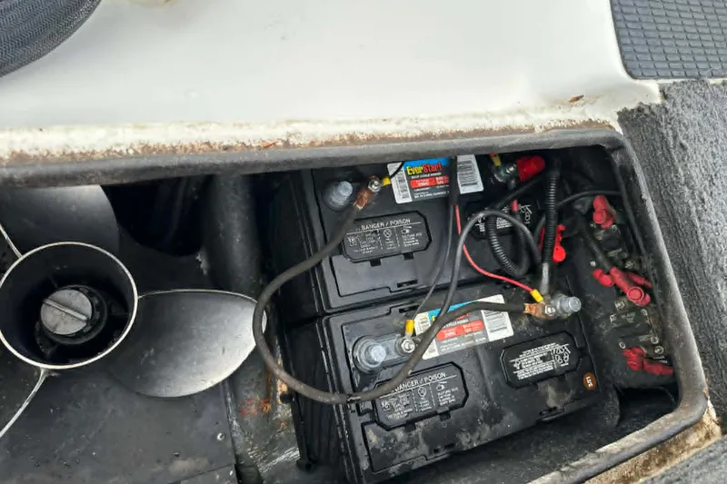 Slide: The Image of Battery compartment of a 2001 Triton Tr-21 Executive DC boat, showing wiring and connections. - 2