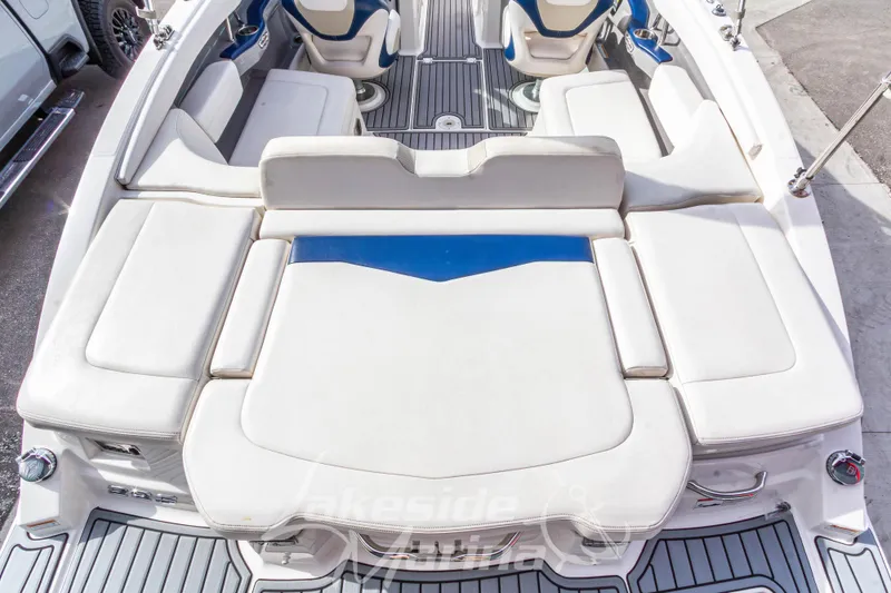 Slide: The Image of 2012 Chaparral 226 SSi boat interior with white seating and blue accents. - 11