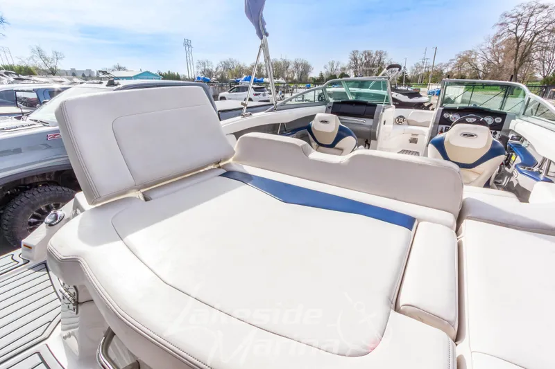 Slide: The Image of 2012 Chaparral 226 SSi boat interior with spacious seating and modern dashboard. - 13