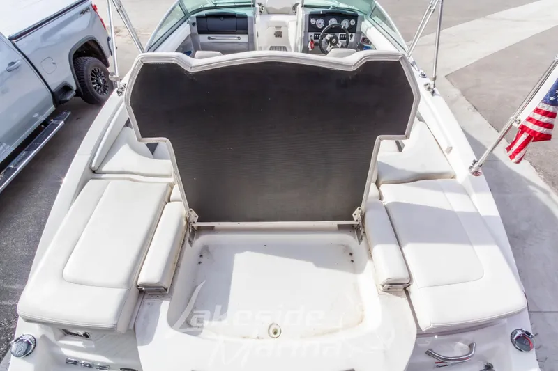 Slide: The Image of 2012 Chaparral 226 SSi boat interior with seating and American flag. - 14