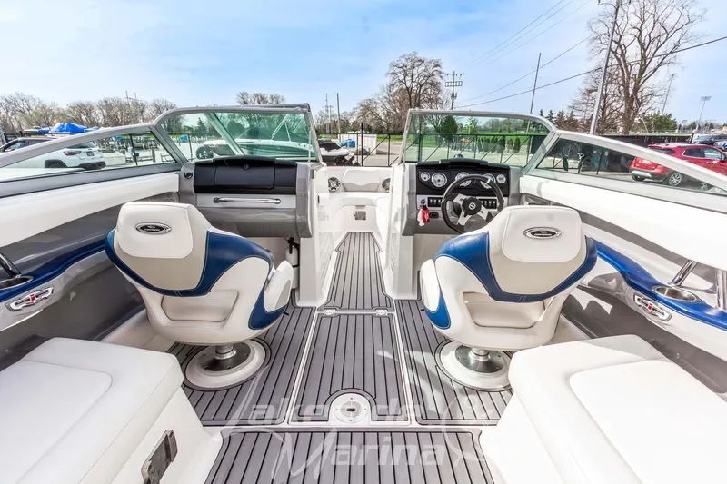 Slide: The Image of Interior view of a 2012 Chaparral 226 SSi boat with modern seating and dashboard. - 21