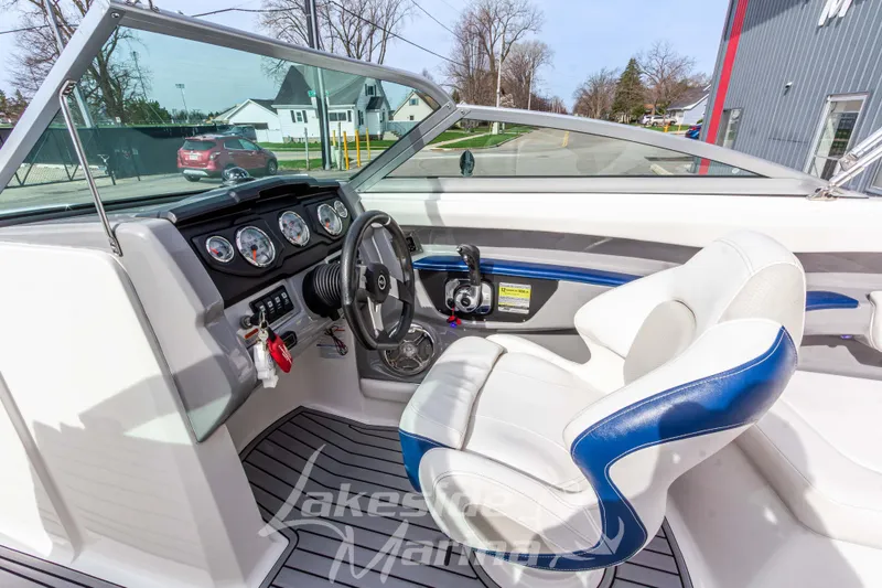 Slide: The Image of Interior view of 2012 Chaparral 226 SSi boat with steering wheel and gauges. - 25
