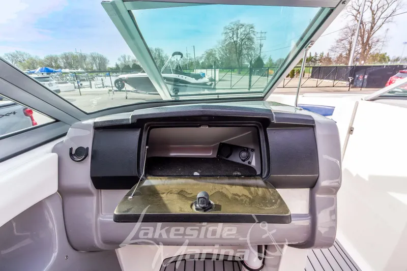 Slide: The Image of 2012 Chaparral 226 SSi boat dashboard with open glove compartment at Lakeside Marina. - 29