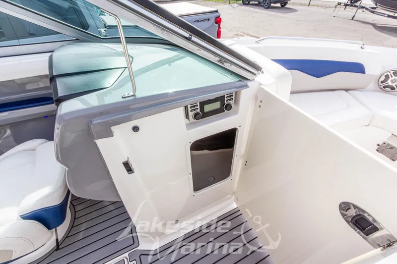 Slide: The Image of Interior view of a 2012 Chaparral 226 SSi boat, featuring seating and control panel. - 32