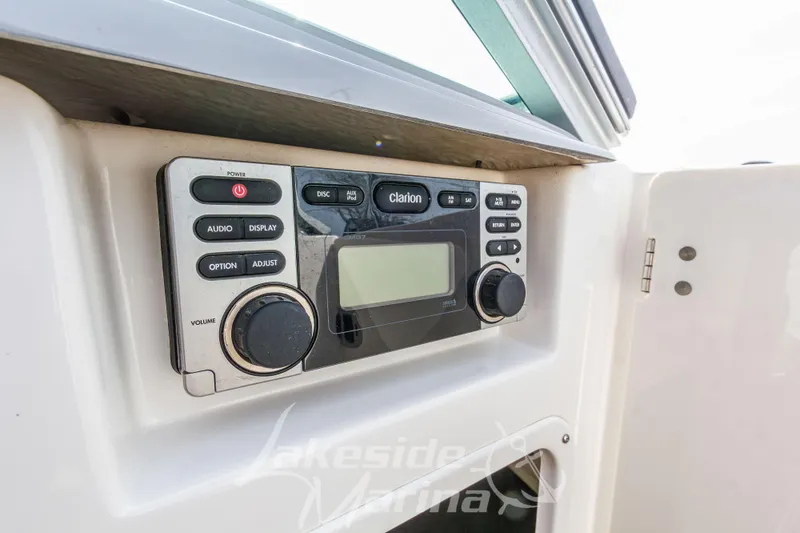 Slide: The Image of Clarion audio system on 2012 Chaparral 226 SSi boat dashboard. - 33