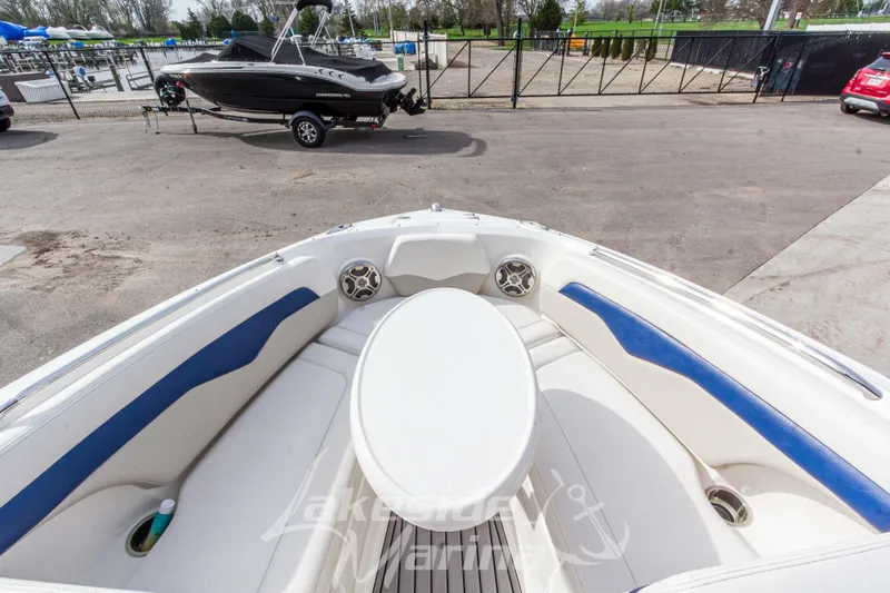 Slide: The Image of Bow seating area of 2012 Chaparral 226 SSi boat with table and speakers. - 35