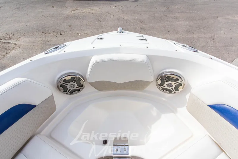 Slide: The Image of Bow seating area of 2012 Chaparral 226 SSi boat with speakers and white upholstery. - 37