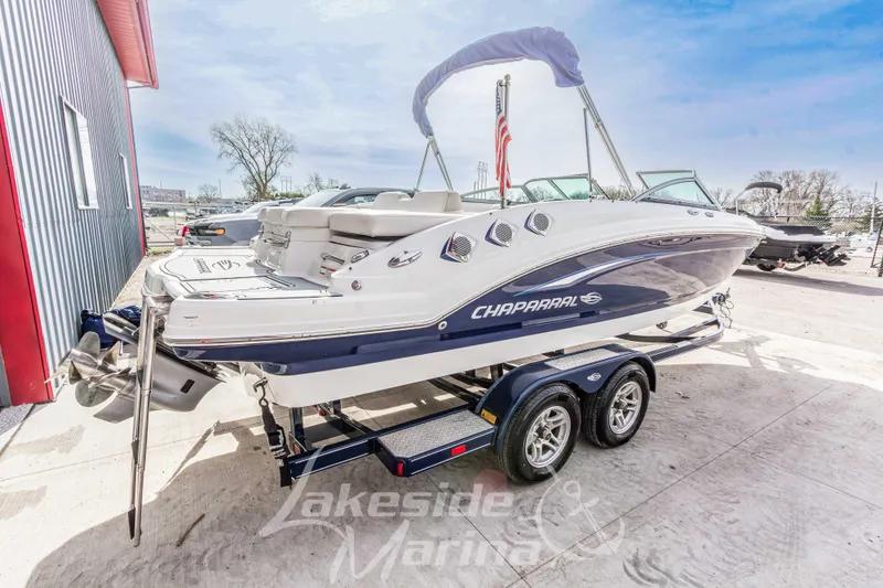 Slide: The Image of 2012 Chaparral 226 SSi boat on trailer at Lakeside Marina, sunny day. - 5