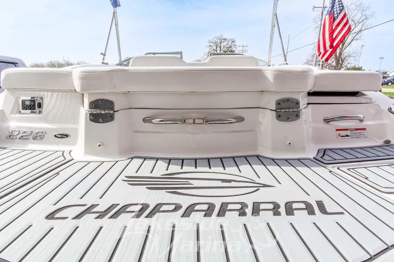 Slide: The Image of Rear view of 2012 Chaparral 226 SSi boat with logo and American flag. - 9