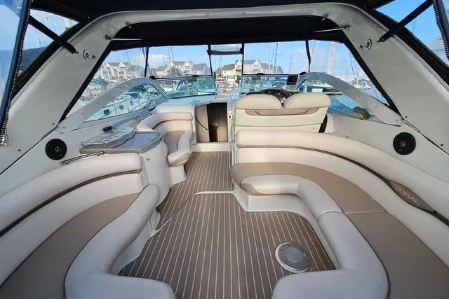 Slide: The Image of Interior of a 1999 Doral 360se boat with luxurious seating and modern design. - 13