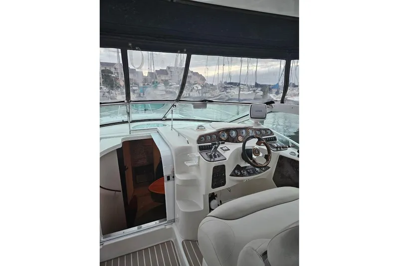 Slide: The Image of 1999 Doral 360se boat docked, featuring "Just Lauren + II" on the stern. - 3
