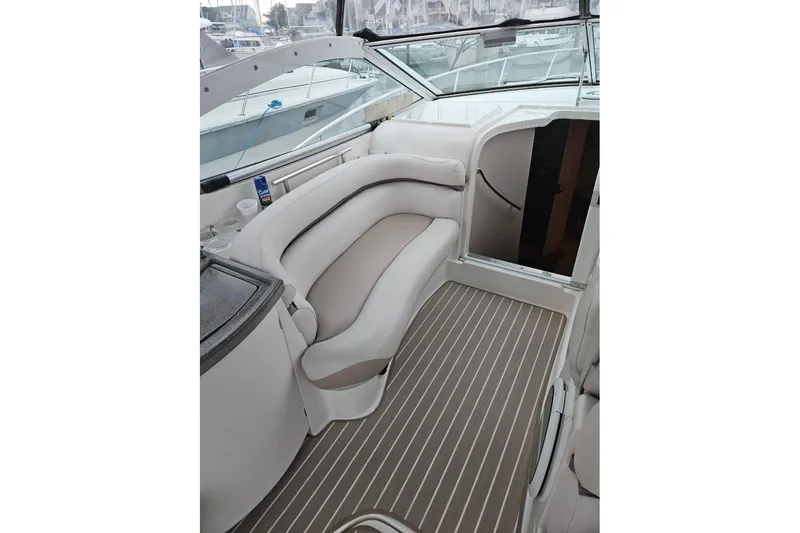 Slide: The Image of Interior cabin of a 1999 Doral 360 SE boat with a patterned bedspread. - 5
