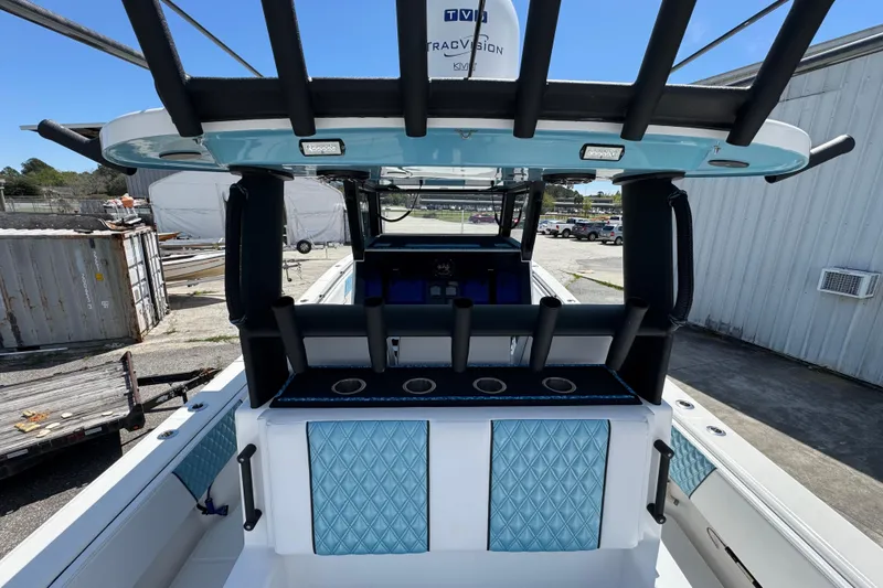 Slide: The Image of 2023 Insetta 35 IFC boat interior with rod holders and quilted upholstery. - 11