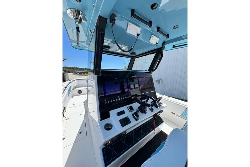 Slide: The Image of 2023 Insetta 35 IFC boat cockpit with advanced navigation controls and sleek design. - 6