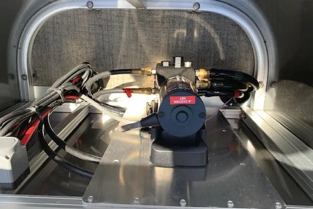 Slide: The Image of Engine compartment of 2025 Avalon 2585 Venture QL High Performance Tri-Toon boat. - 11