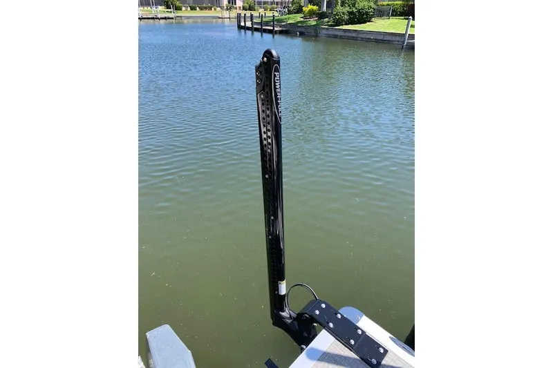 Slide: The Image of 2025 Avalon 2585 Venture QL Tri-Toon with Power-Pole anchor on calm water. - 9