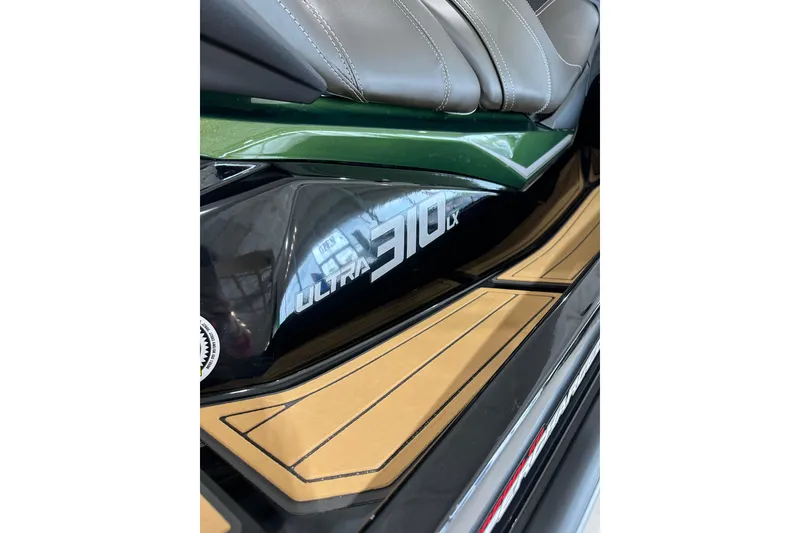 Slide: The Image of 2025 Kawasaki JV1500ASFNN Ultra 310LX jet ski, close-up of seat and side panel. - 3