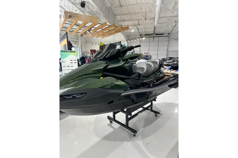 Slide: The Image of 2025 Kawasaki JV1500ASFNN jet ski displayed in a showroom, featuring sleek design and modern technology. - 5