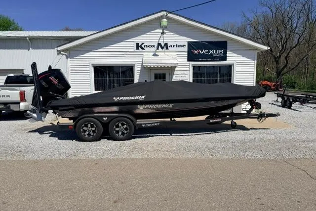 The Image of 2022 Phoenix 721 ProXP boat covered, parked outside Knox Marine dealership. - 0