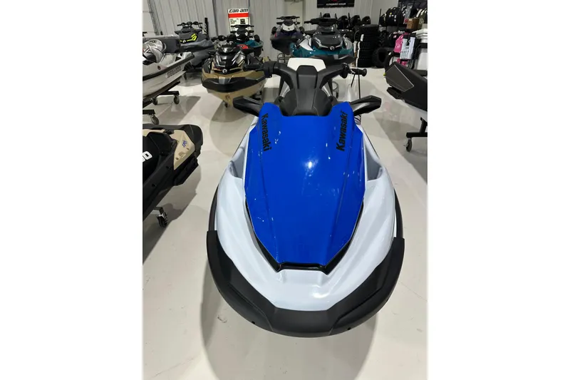 Slide: The Image of 2024 Kawasaki JN1500CRFNN jet ski in showroom, featuring sleek blue and white design. - 3