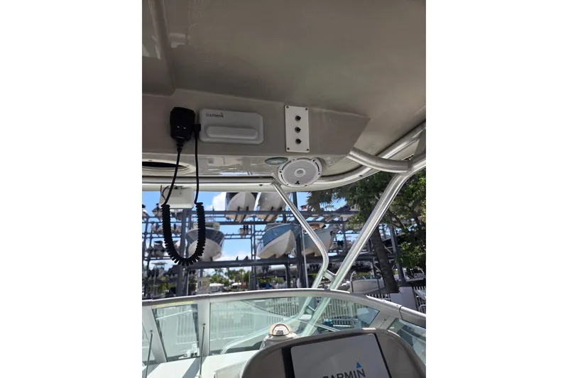 Slide: The Image of 2008 Robalo R265 Walkaround boat interior with Garmin electronics and speaker system. - 8
