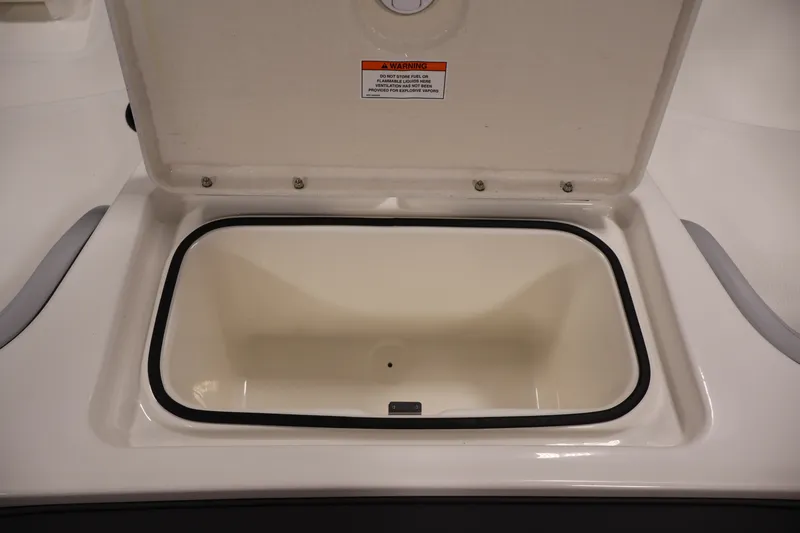 Slide: The Image of Open storage compartment on 2026 Bayliner Element M17 boat. - 21