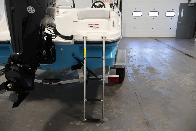 Slide: The Image of 2026 Bayliner Element M17 boat with ladder and motor in a garage. - 23
