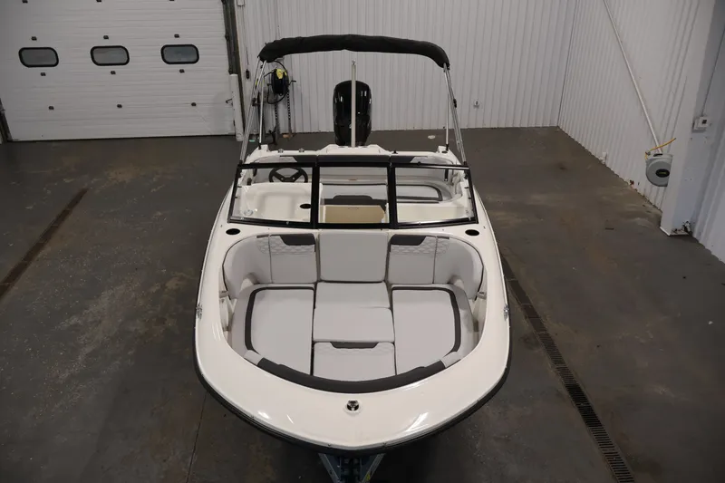 Slide: The Image of 2026 Bayliner Element M17 boat in indoor storage, showcasing sleek design and spacious seating. - 8