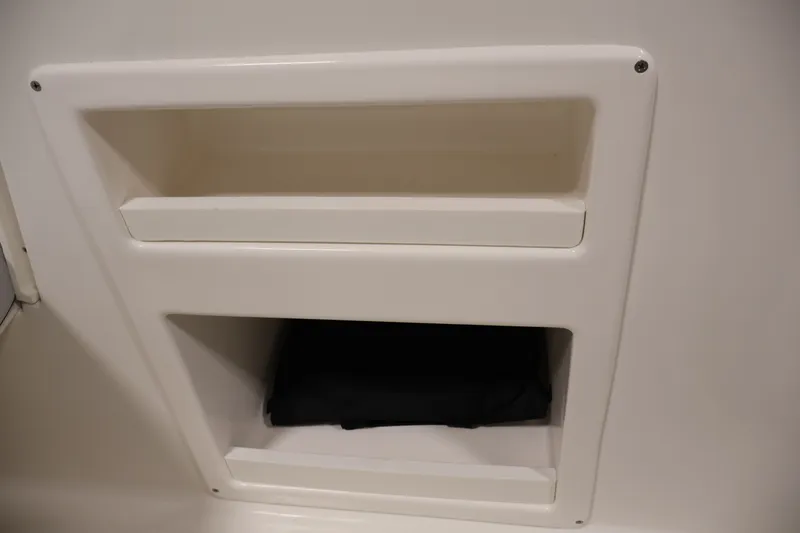 Slide: The Image of Storage compartments on a 2026 Bayliner Element M17 boat interior. - 13