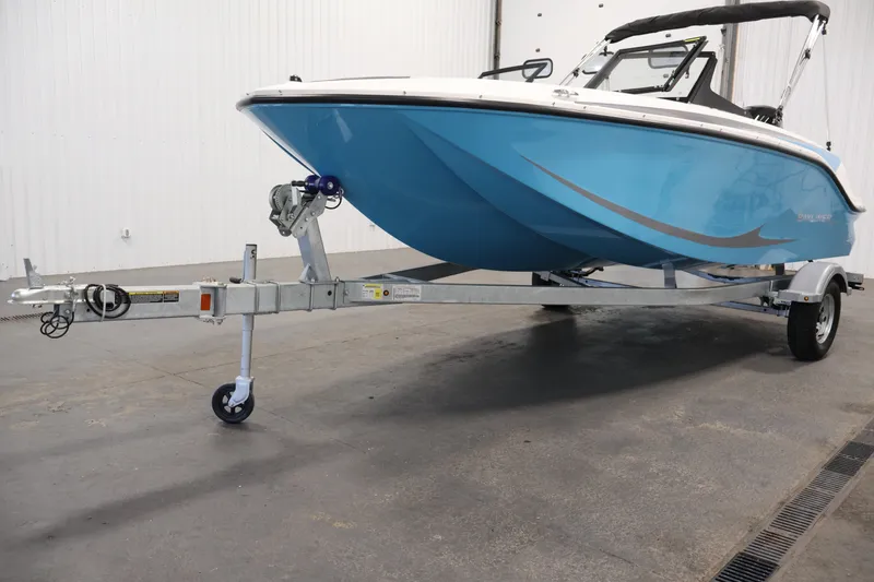 Slide: The Image of 2026 Bayliner Element M17 boat on trailer in indoor setting. - 28