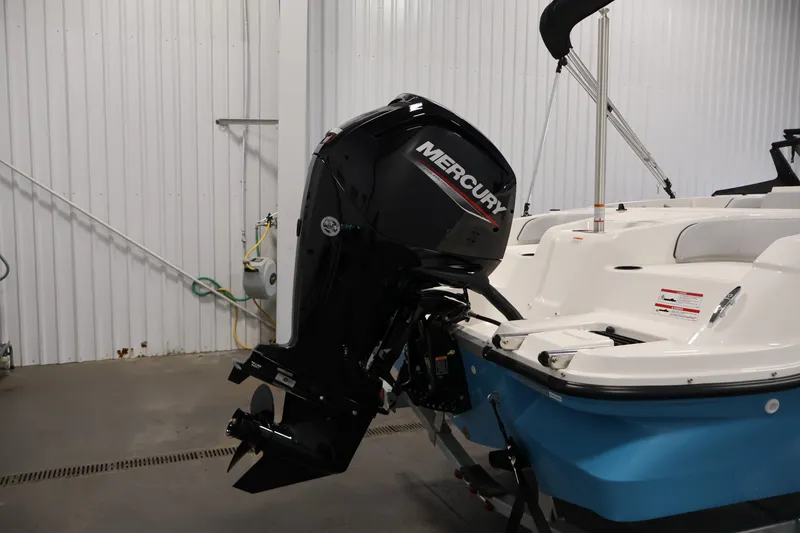 Slide: The Image of 2026 Bayliner Element M17 with Mercury outboard motor in a storage facility. - 24