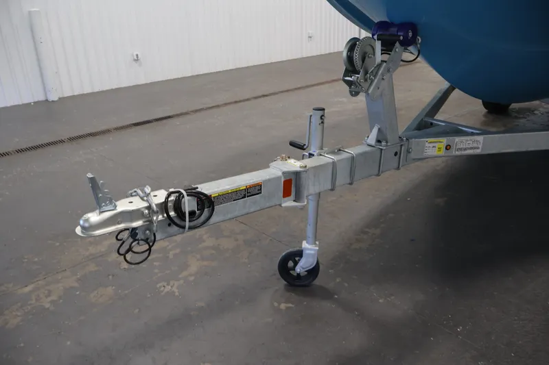 Slide: The Image of Trailer hitch of 2026 Bayliner Element M17 boat in a garage setting. - 27