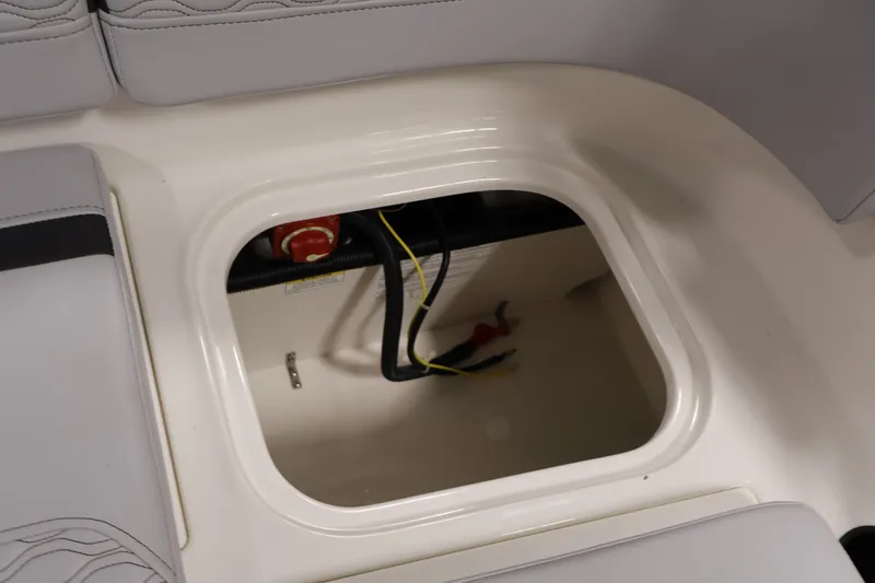 Slide: The Image of Storage compartment in 2026 Bayliner Element M17 boat, featuring wiring and battery access. - 20