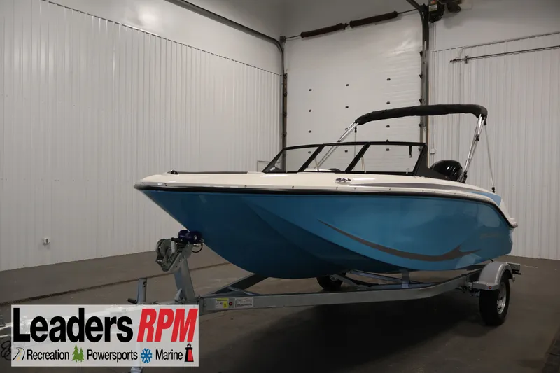 The Image of 2026 Bayliner Element M17 boat on trailer in indoor showroom. - 0