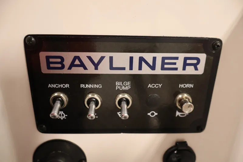 Slide: The Image of Control panel of 2026 Bayliner Element M17 boat with labeled switches. - 17