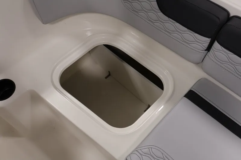 Slide: The Image of 2026 Bayliner Element M17 boat storage compartment with cushioned seating. - 19