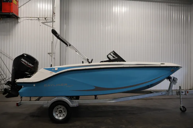 Slide: The Image of 2026 Bayliner Element M17 boat on trailer in indoor setting. - 3