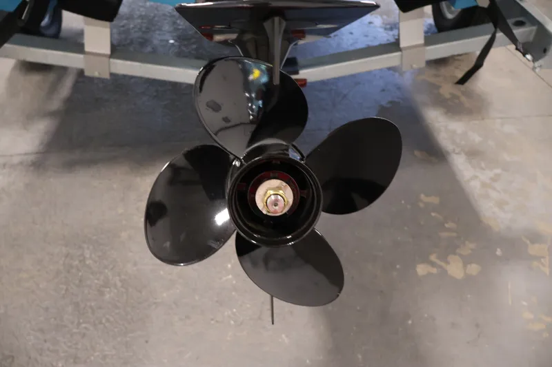 Slide: The Image of Propeller of 2026 Bayliner Element M17 boat on display in a showroom. - 26