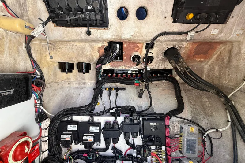 Slide: The Image of Electrical wiring and components inside a 1989 Wellcraft 302 Scarab boat. - 105