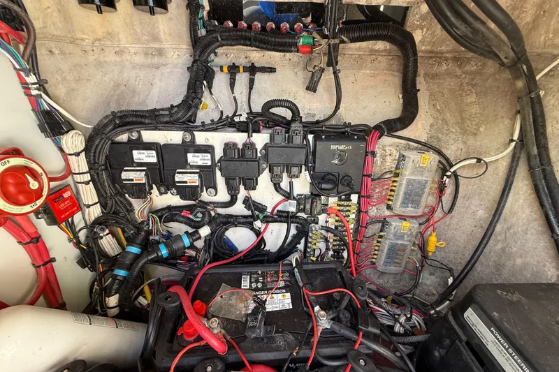 Slide: The Image of Electrical wiring and components inside a 1989 Wellcraft 302 Scarab boat. - 106